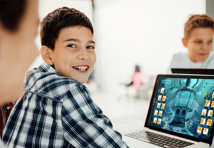Student smiling while using a Laptop with Lumio loaded